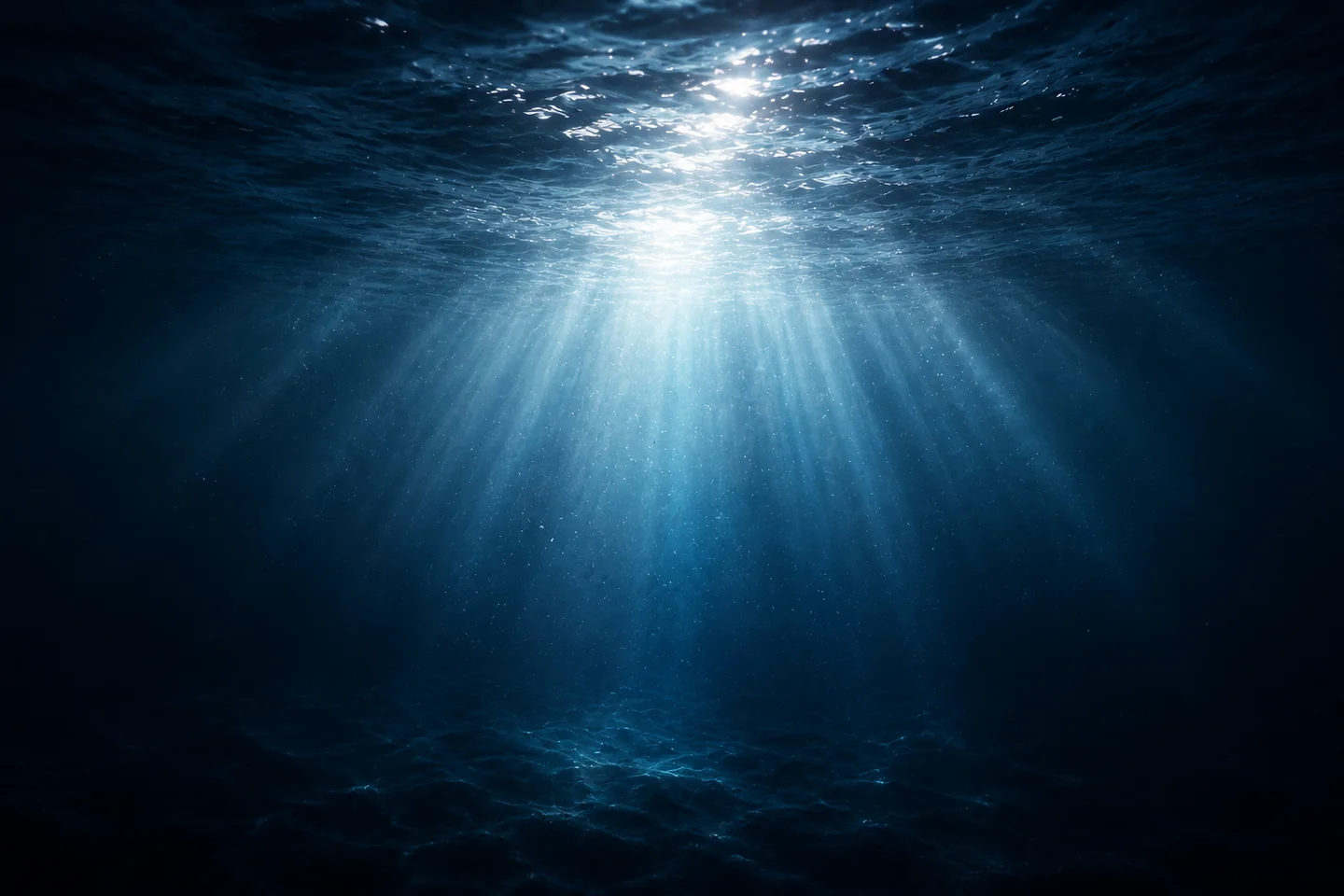 Sunlight filtering through a deep blue ocean.